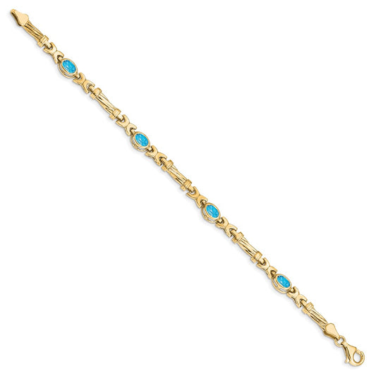 10k Oval Blue Topaz Bezel 4-Stone 7.25 inch Bracelet