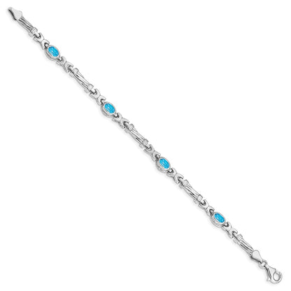 10k White Gold Oval Blue Topaz Bezel 4-Stone 7.25 inch Bracelet