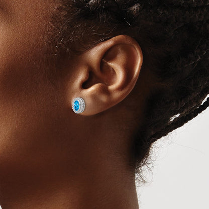 10k White Gold 6x4mm Oval Blue Topaz Post Earrings