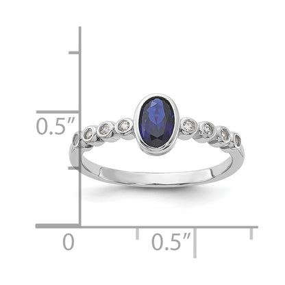 SS Rh-plated  .01Created White Sapphire .56Created Blue Spinel Ring