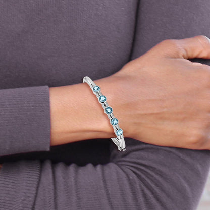 Sterling Silver Rhodium-plated Light Swiss Blue Topaz Hinged Bangle